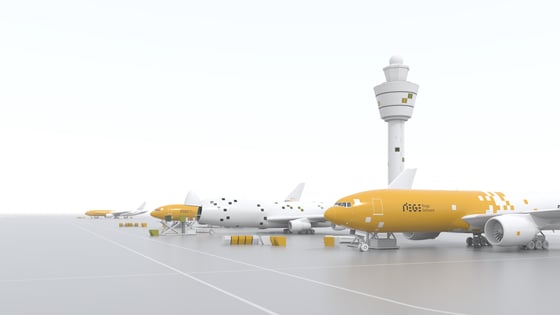 Four cargo airplanes stand in front of a tower.