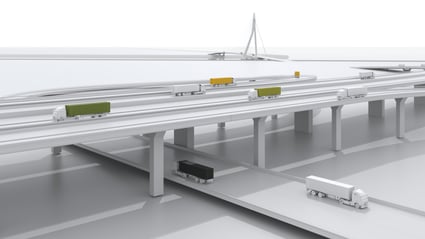 Several trucks drive over and under a bridge.