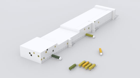 Eine Lagerhalle aus der Vogelperspektive. Vor dieser Lagerhalle stehen mehrere LKWs.